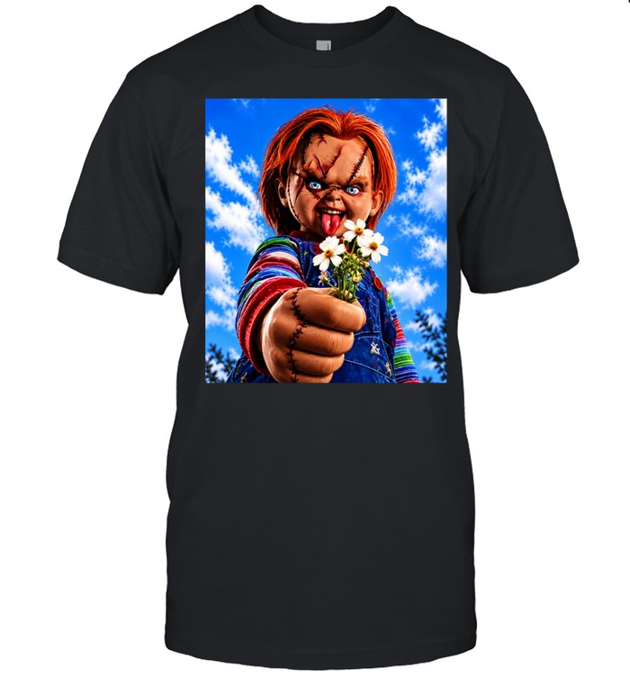 Chucky Child’s Play character holding flowers against blue sky Unisex T-Shirt